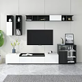 Modern TV Wall Unit with White Black Design Open Shelves Decorative Items and Green Plant