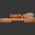 Roasted Chicken Drumsticks on Wooden Cutting Board with Bread Slices and Black Peppercorns