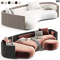 Stylish Curved Two Seater Sofa With White Pink Brown Upholstery And Decorative Pillows
