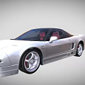 Sleek Silver Two Door Sports Car With Red Seats And Alloy Wheels
