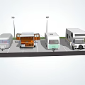 Different Types Of RVs Parked In Parking Lot With Street Lamps And Grass