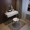 White Dressing Table with Round Mirror Cosmetics Pink Frame and Black Chair on Geometric Rug