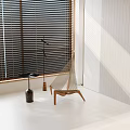 Inflatable Hammock Chair In Bright Indoor Space With Window Blinds And Side Table
