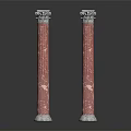 Two Red Marble Roman Columns With Ornate Carved Capitals And Classic Design