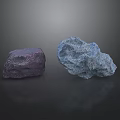 Two Purple And Blue Rockery Stones On Black Background With Reflections