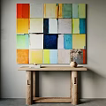 Colorful Abstract Painting On Wall Above Wooden Console Table With Vase And Decorative Book Decoration