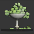 Fresh Green Olives in Glass Goblet on Silver Tray with Scattered Fruits