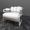 Modern Black Single Sofa Featuring Unique Armrest Design Against Light Wall On Herringbone Floor 3d model
