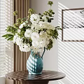 Decorative Ornament Set with Blue Vase White Flowers Greenery on Wooden Table and Wall Art