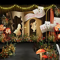 Alice in Wonderland Banquet Hall Decorated With Playing Cards Flowers Clock Mushroom And String Lights