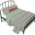 Double Bed With Black Metal Frame Curved Headboard Green Quilt And Leopard Print Blanket
