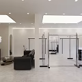 Modern Beauty Salon Interior Open Layout Black Sofa Glass Clothing Racks White Walls Gray Floors