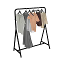 Metal Clothes Rack With Wheels Hanging Different Colored Apparel And Garments