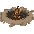 Natural Stone Ringed Campfire Pit With Burning Wood Logs On Sand