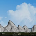 Garden Ornaments With White Rock Formations Green Lawn And Red Flowers Under Blue Sky