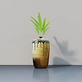Potted Bonsai Plant With Green Leaves In Brown Blue Ceramic Pot On Smooth Gray Surface