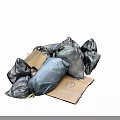 Pile of Gray Garbage Bags and Cardboard Box for Waste Disposal