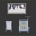 Medical Imaging Monitor Showing X Ray Images With Mobile Cart And Waste Bin
