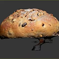 Fresh Round Raisin Bread with Cross Slits Golden Brown Surface and Dried Fruits Inside