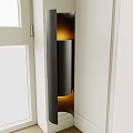 Contemporary Cylindrical Wall Sconce With Warm Ambient Lighting On White Interior Wall And Window