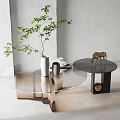 Elegant Round Glass Coffee Table With Metal Frame Decorative Green Plant Vase And Horse Figurine