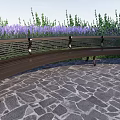Curved Metal Landscape Bench With Striped Seat Purple Flowers And Stone Pavement