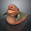 Fantasy Creature Sculpture In Orange And Green With Rounded Body Detailed Carving And Expressive Features