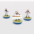 Three Pink Character Figurines Standing on Circular Bases with Colorful Platforms