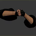 Man With Black Gloves On Arms Showing Fist Gesture Against Gray Background