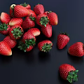 Fresh Ripe Strawberries with Red Fruit and Green Leaves on Black Background