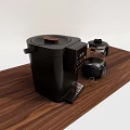 Modern Black Coffee Maker With Digital Display And Glass Carafe On Wooden Tabletop