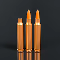 Three Orange Military Weapon Bullets Standing On Black Background With Reflections