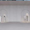 Sleek Silver Faucets With Long Metal Pipes In Arched Niche On Light Gray Wall