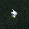 White Square Outdoor Light Glowing Brightly On Lush Green Grass Lawn
