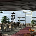 Traditional Stone Torii Gates With Red Carpet Tower Like Structures And Fruit Platter