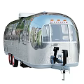 Shiny Silver Vintage Trailer With Shiny Exterior Red Wheels And Classic Design