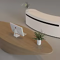 Modern Wooden And White Curved Cashier Counter Featuring Computer Monitor Vase And Green Plants