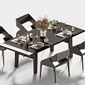 Modern Black Dining Table And Chairs Set With Tableware Flower Arrangement And Decorative Items