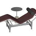 Burgundy Lounge Chair With Metal Frame And Round Concrete Side Table