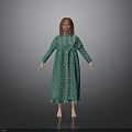 Woman In Green Long Dress With White Trim Standing Barefoot Against Gray Background