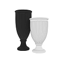 Decorative Ornament Set Featuring Black And White Fluted Vases With Pedestal Bases