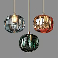 Colored Glass Pendant Lights With Spherical Textured Design And Illuminated Metal Fixtures