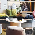 Modern Apartment With Glass Railing Staircase Sofa Colorful Pillows Chandelier Green Plants And Marble Floor