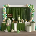 Delicious Cream Cake and Desserts Display on Green Decorated Table With Balloons and White Accents