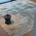 Stylish Rug with 3D Wavy Textured Pattern and Black Round Side Table with Glass Bottle