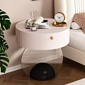 Elegant Modern Bedroom Interior With White Bedside Table Gold Accents Clock And Monstera Plant