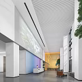 Modern Lobby Reception Desk With Large Windows Green Plants And Warm Lighting
