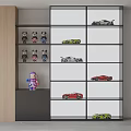 Colorful Dolls Arranged On Display Shelf With Various Car Models