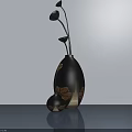 Modern Black Vase With Golden Leaf Patterns And Floral Stems On Smooth Tabletop