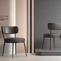 Modern Designer Black Leather Dining Chairs with Sleek Design and Gray Beige Wall Background